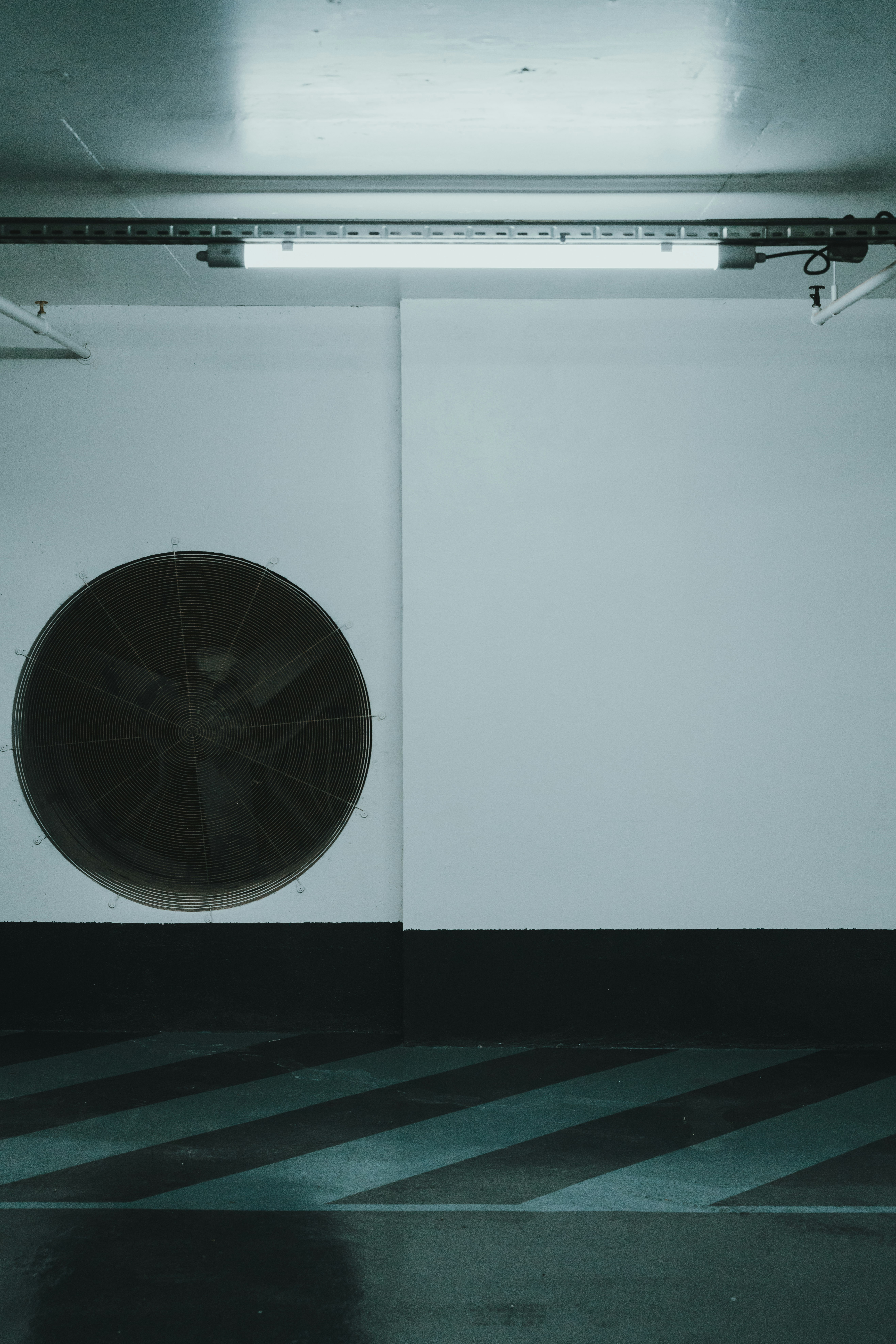black round wall mounted fan
